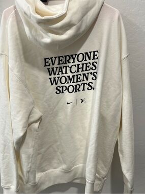 Nike Cream Hoodie with Bold Black "Everyone Watches Women's Sports." Print